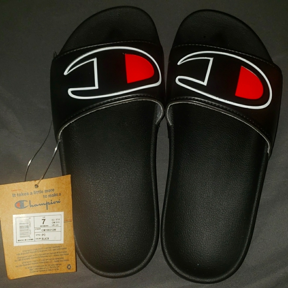 Women's Champion slides NWT size 7 Black with red champion logo.